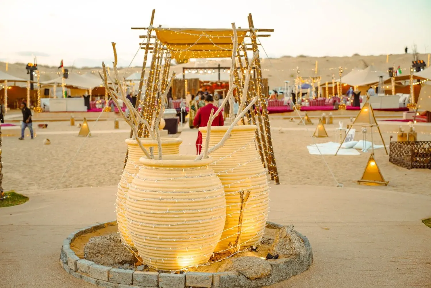 Wedding guests dining under open sky at a desert camp in Abu Dhabi