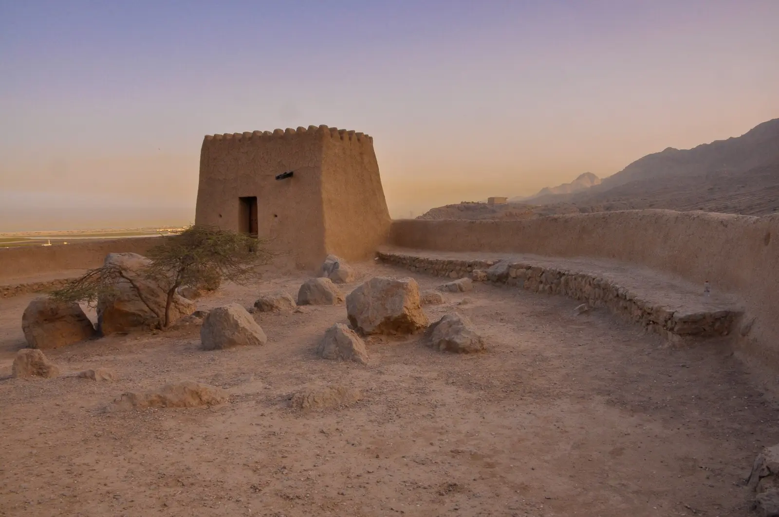 Dhayah Fort on its hilltop in Ras Al Khaimah at dusk