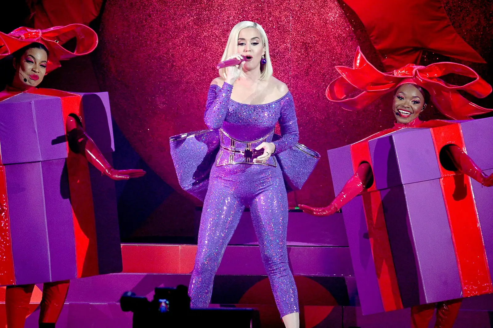 Katy Perry on stage between giant gift boxes
